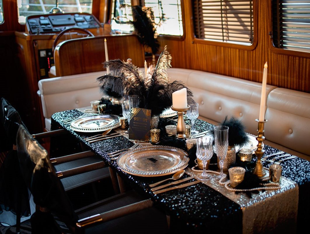 Black and gold feathers and fluff decorations for dinner party