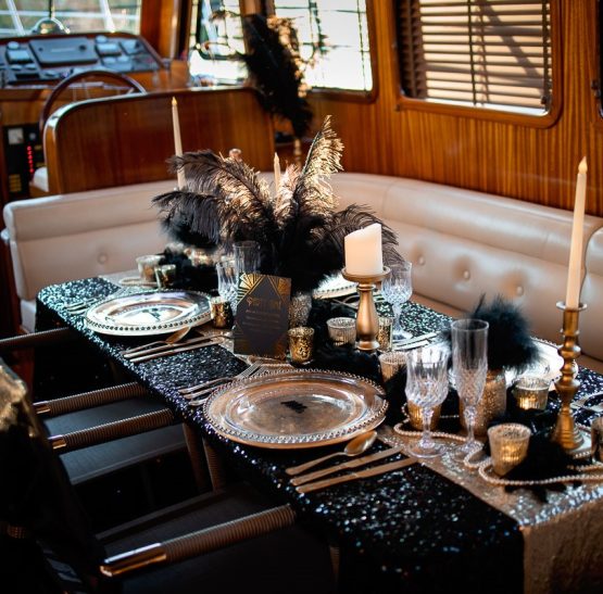 Black and gold feathers and fluff decorations for dinner party